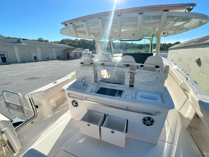  Yacht Photos Pics 2025 Grady-White Canyon 386 boat interior with seating and storage compartments.