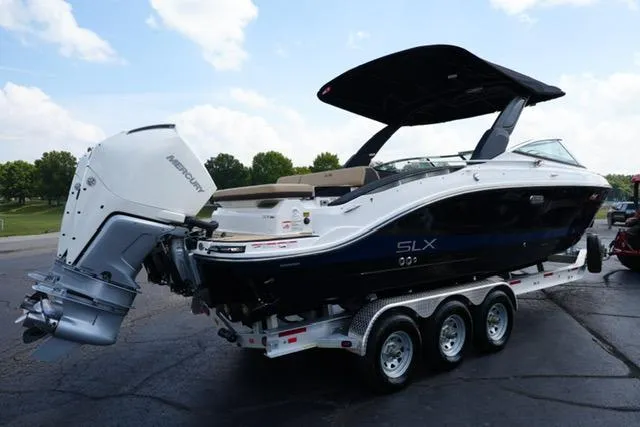  Yacht Photos Pics 2024 Sea Ray 280 SLX boat on trailer, featuring sleek design and powerful outboard engine.