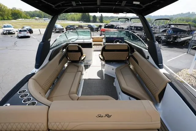  Yacht Photos Pics 2024 Sea Ray 280 SLX boat interior with luxurious tan seating and sleek design.