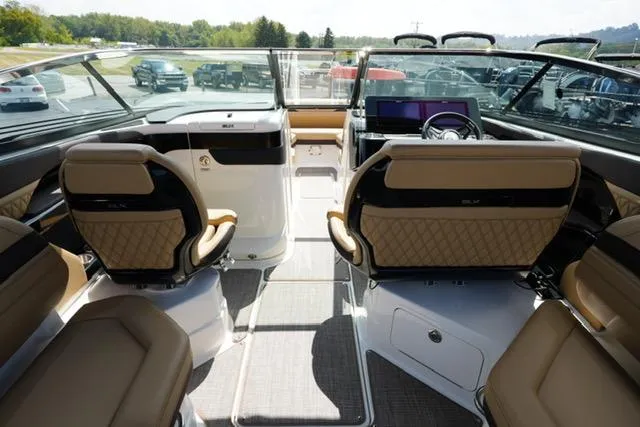  Yacht Photos Pics 2024 Sea Ray 280 SLX boat interior with luxurious seating and modern dashboard.