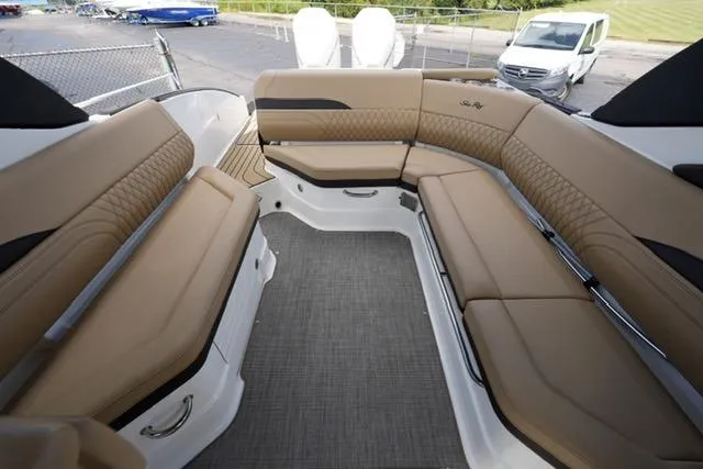  Yacht Photos Pics 2024 Sea Ray 280 SLX boat interior with tan leather seating and modern design.