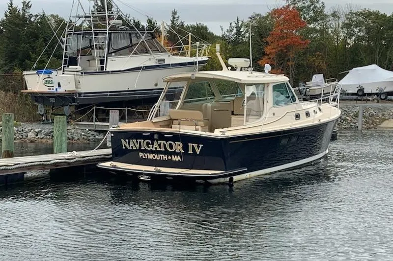 Navigator Yacht Photos Pics 2002 Island Packet Craft Express 360 boat docked, named "Navigator IV," in Plymouth, MA marina.
