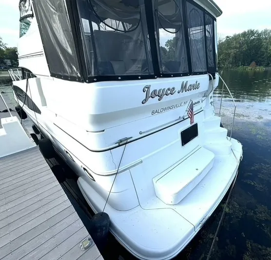  Yacht Photos Pics 2004 Carver 466 Motor Yacht docked, rear view with name "Joyce Marie."