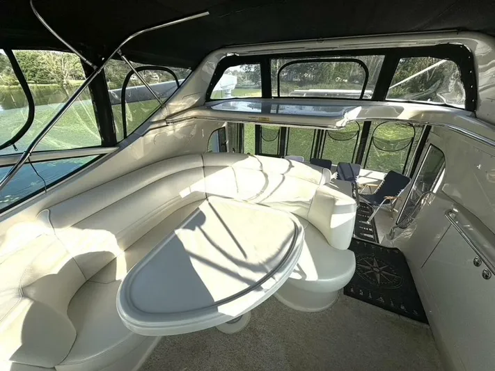  Yacht Photos Pics Interior of 2004 Carver 466 Motor Yacht with plush seating and large windows.