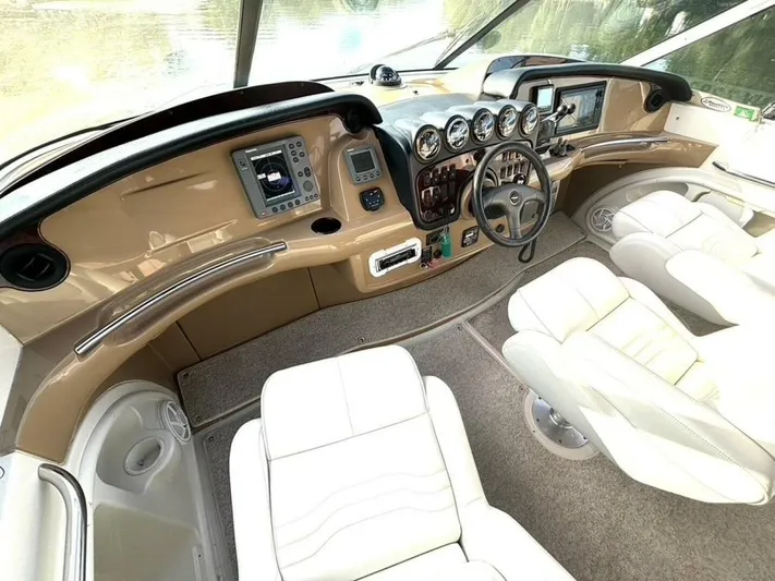  Yacht Photos Pics 2004 Carver 466 Motor Yacht helm with modern controls and plush seating.