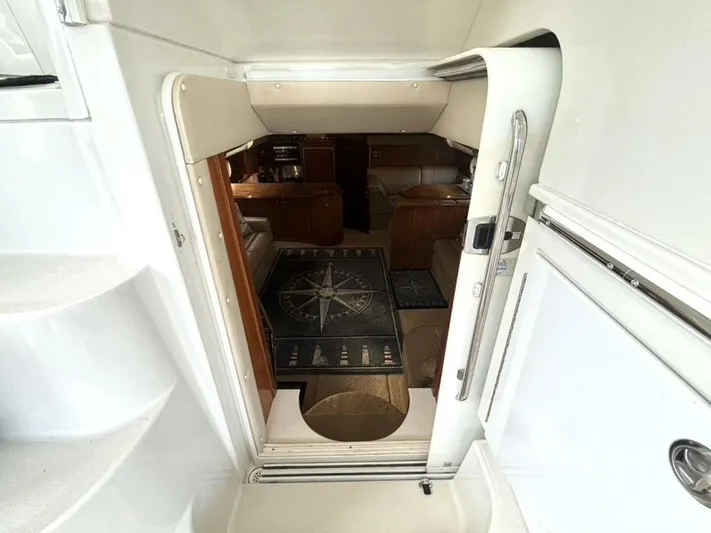  Yacht Photos Pics Interior view of 2004 Carver 466 Motor Yacht, featuring elegant seating and nautical-themed decor.