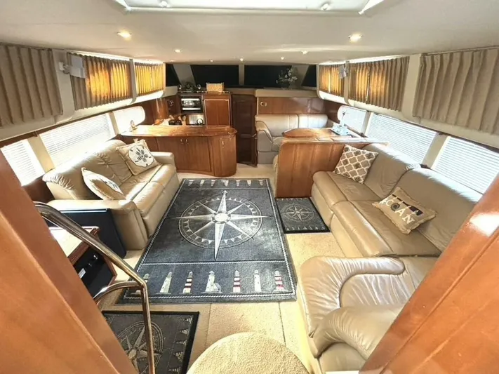  Yacht Photos Pics Luxurious interior of 2004 Carver 466 Motor Yacht with plush seating and nautical decor.