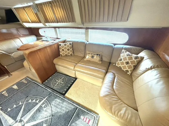  Yacht Photos Pics Luxurious interior of 2004 Carver 466 Motor Yacht with leather seating and nautical decor.