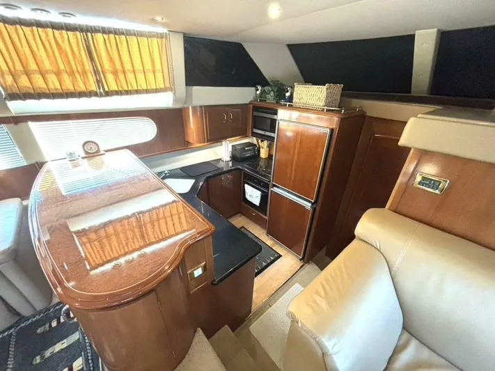  Yacht Photos Pics Luxurious interior of 2004 Carver 466 Motor Yacht with elegant wood finishes.