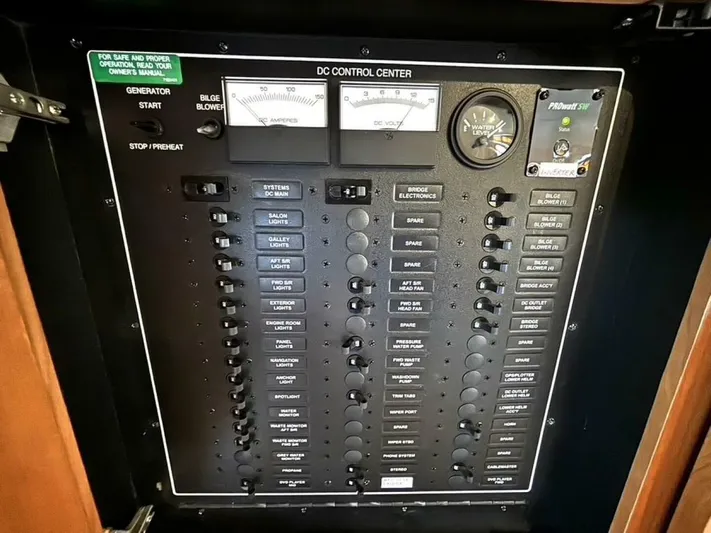  Yacht Photos Pics Control panel of a 2004 Carver 466 Motor Yacht, featuring various switches and gauges.