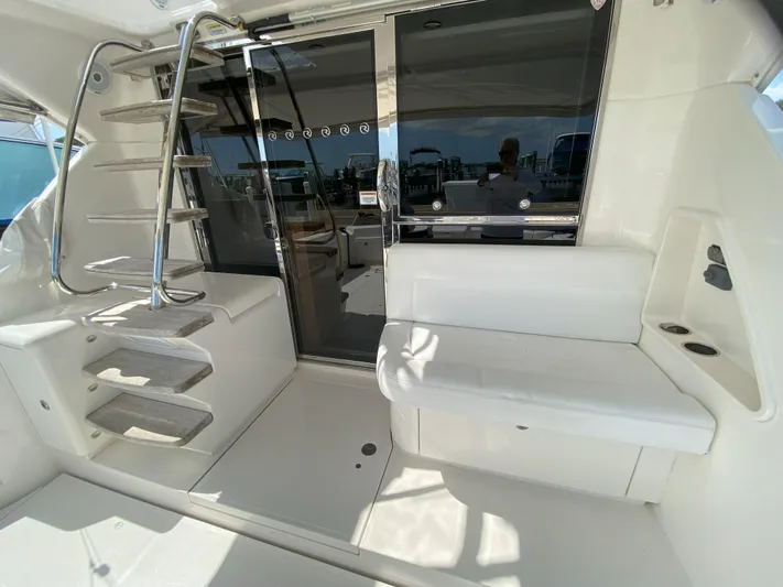 Yacht Photos Pics 2016 Riviera 43 Open Flybridge yacht interior with sleek seating and modern staircase.