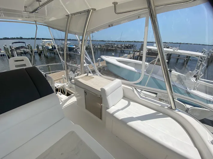  Yacht Photos Pics 2016 Riviera 43 Open Flybridge interior with marina view.