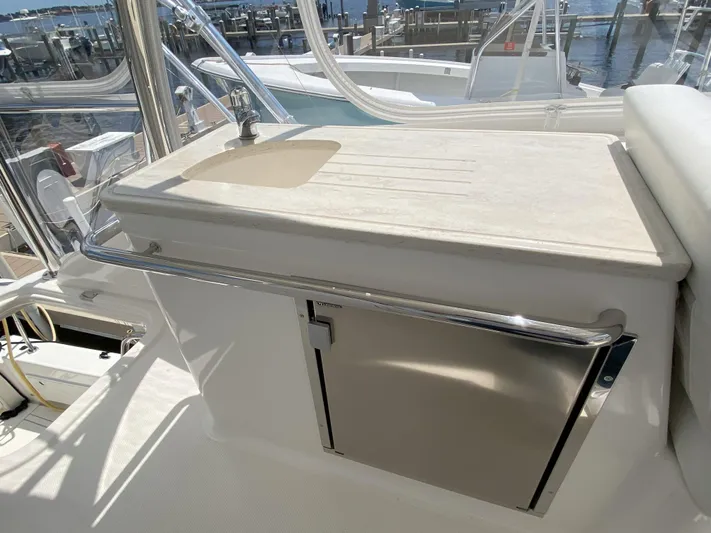  Yacht Photos Pics Riviera 43 Open Flybridge 2016 yacht with outdoor sink and storage.