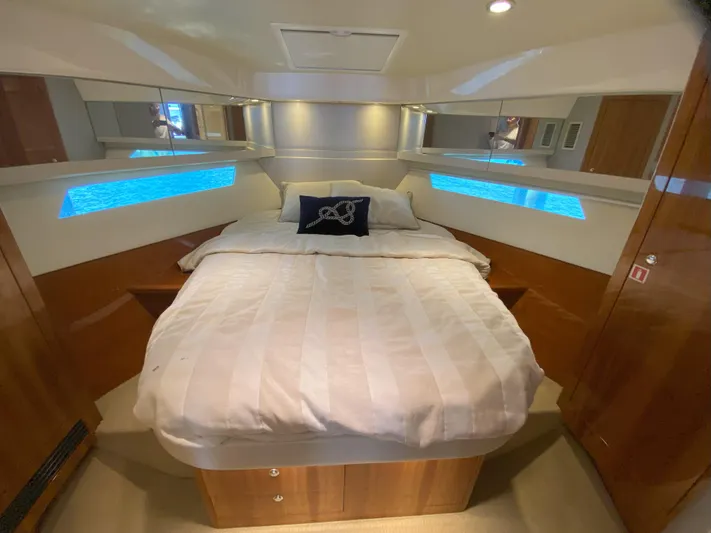  Yacht Photos Pics Luxurious bedroom interior of 2016 Riviera 43 Open Flybridge yacht.