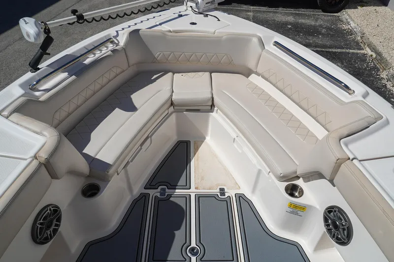  Yacht Photos Pics 2021 Blue Wave Boats Makaira interior with cushioned seating and cup holders.