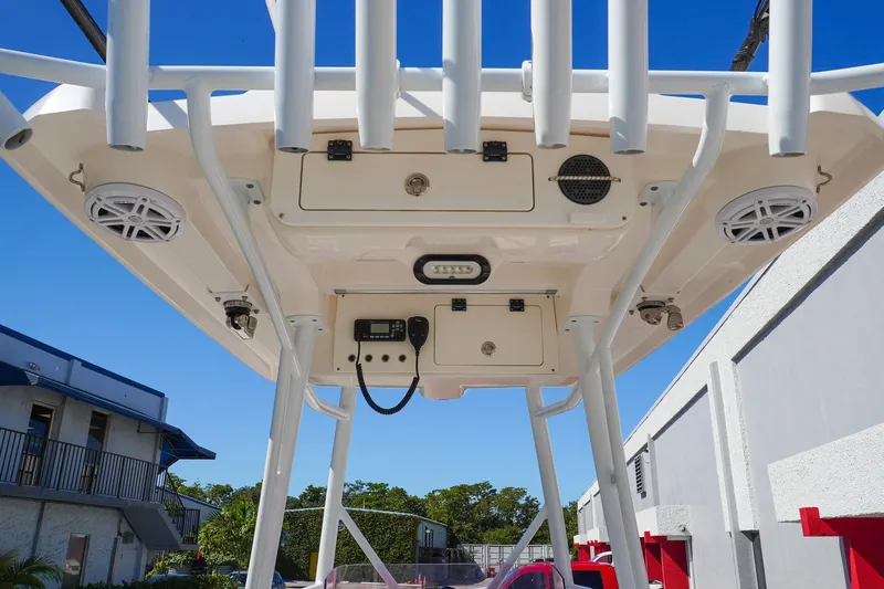  Yacht Photos Pics 2021 Blue Wave Boats Makaira T-top with speakers and storage compartments.