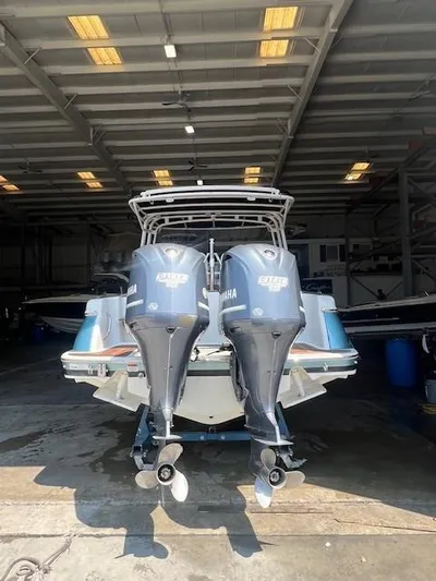  Yacht Photos Pics 2014 Chris-Craft Catalina 29 with twin Yamaha engines in a boat storage facility.