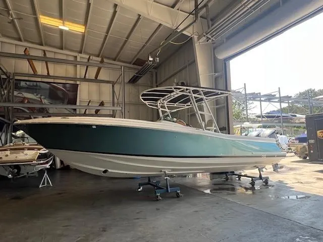  Yacht Photos Pics 2014 Chris-Craft Catalina 29 boat in a spacious indoor storage facility.