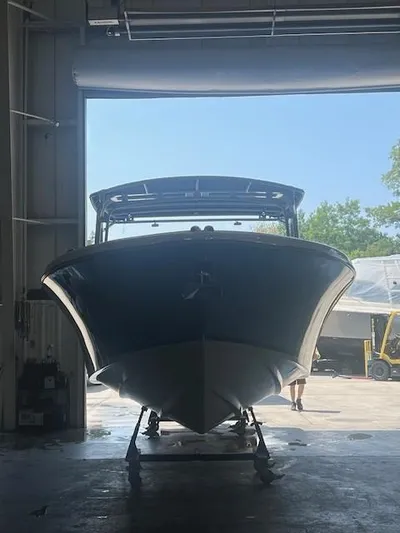  Yacht Photos Pics 2014 Chris-Craft Catalina 29 boat in a garage, front view, natural light.