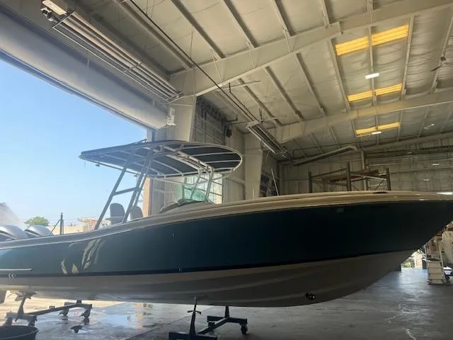  Yacht Photos Pics 2014 Chris-Craft Catalina 29 boat in a spacious indoor storage facility.