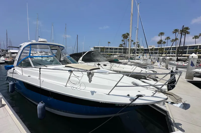 Relentless Yacht Photos Pics 2020 Monterey 355 Sport Yacht docked at a marina under a clear blue sky.