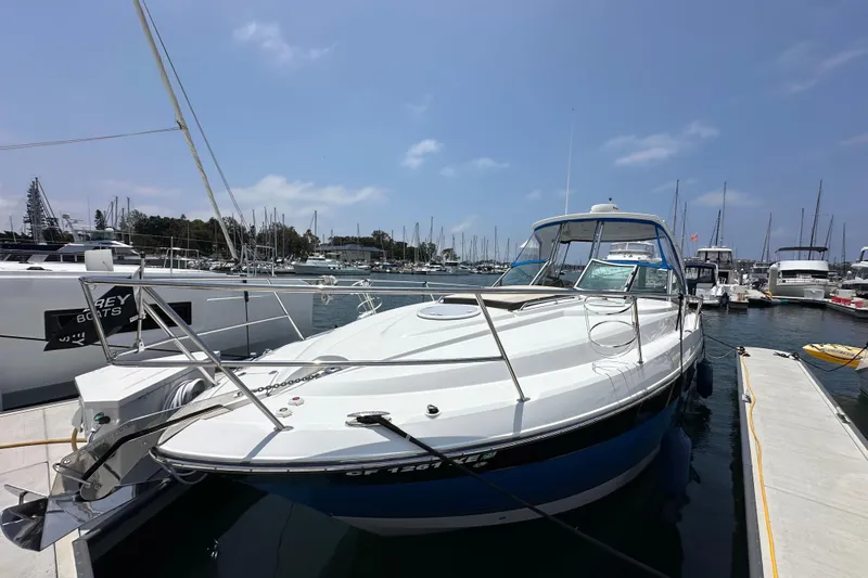 Relentless Yacht Photos Pics 2020 Monterey 355 Sport Yacht docked at marina under clear blue sky.