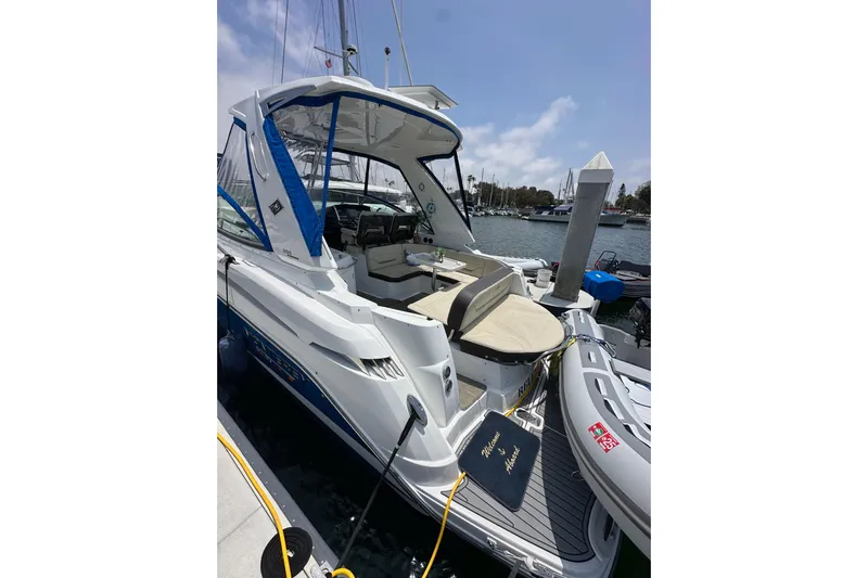 Relentless Yacht Photos Pics 2020 Monterey 355 Sport Yacht docked at marina, featuring spacious seating and sleek design.