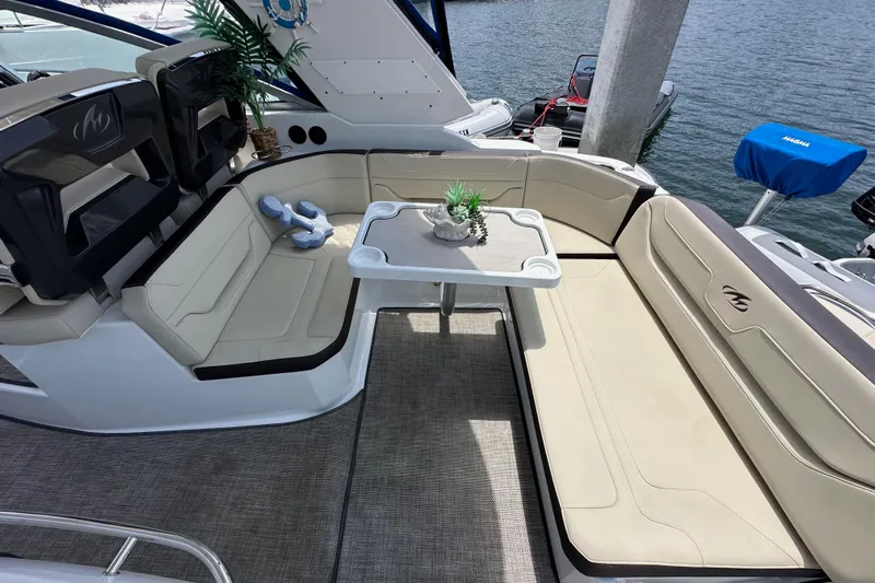 Relentless Yacht Photos Pics Luxury seating area on a 2020 Monterey 355 Sport Yacht with table and decor.