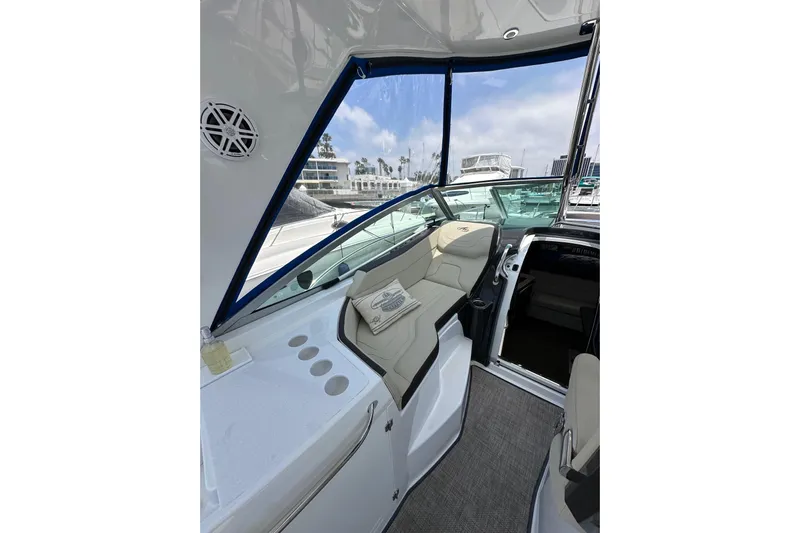 Relentless Yacht Photos Pics Interior view of 2020 Monterey 355 Sport Yacht with seating and marina backdrop.