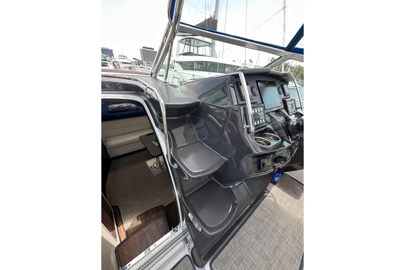 Relentless Yacht Photos Pics 2020 Monterey 355 Sport Yacht helm with modern controls and cabin entrance.