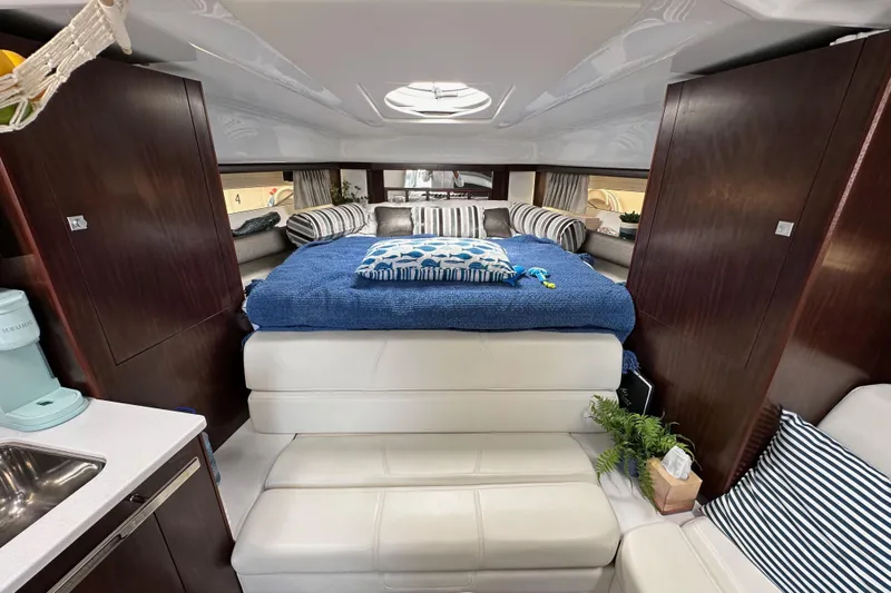 Relentless Yacht Photos Pics Luxurious interior of 2020 Monterey 355 Sport Yacht with cozy bed and modern amenities.