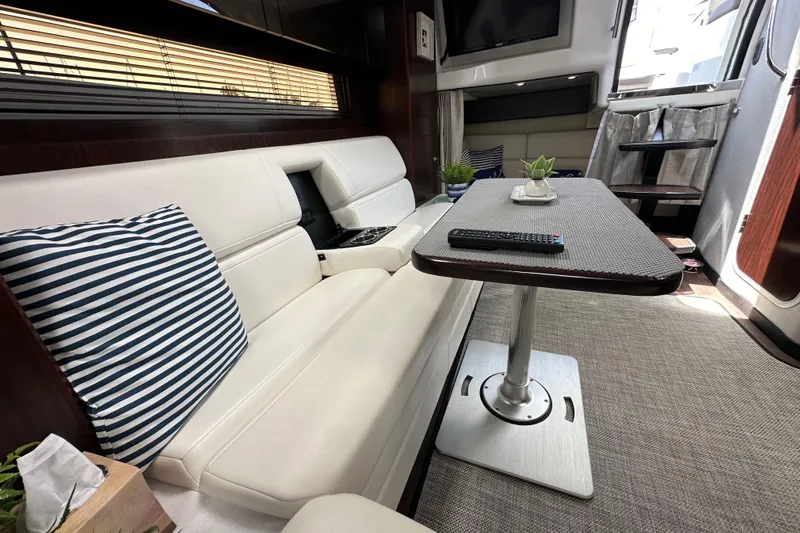 Relentless Yacht Photos Pics Luxurious interior of 2020 Monterey 355 Sport Yacht with plush seating and modern decor.