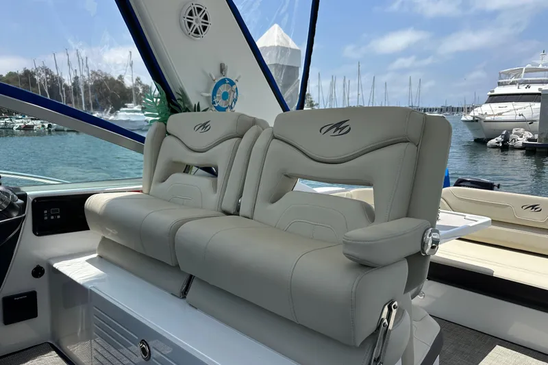 Relentless Yacht Photos Pics Luxury seating on a 2020 Monterey 355 Sport Yacht, docked at a marina.