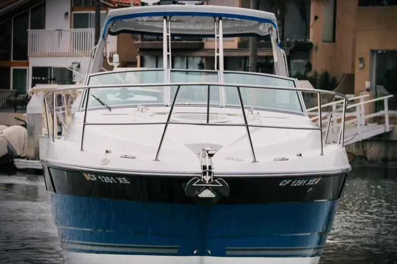 Relentless Yacht Photos Pics 2020 Monterey 355 Sport Yacht docked in a marina, front view.