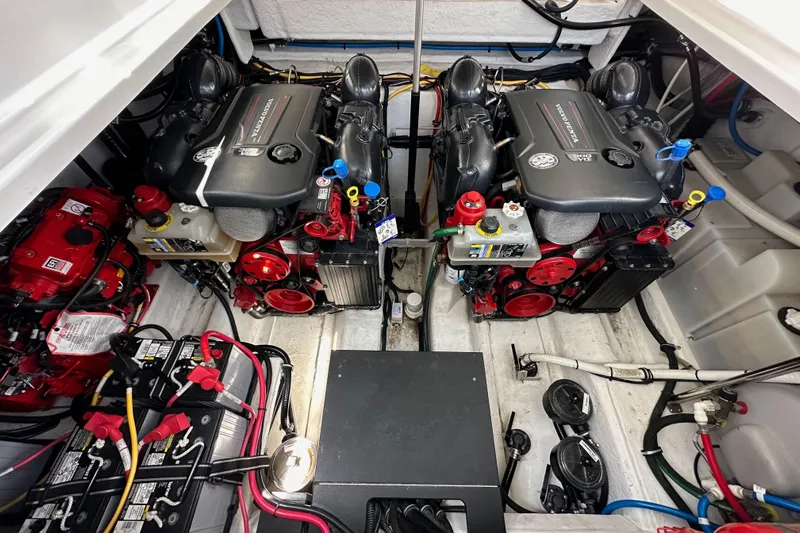 Relentless Yacht Photos Pics Engine compartment of a 2020 Monterey 355 Sport Yacht, showcasing dual engines and wiring.