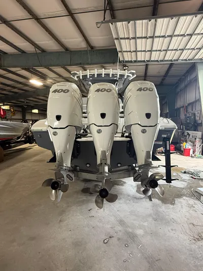 Fountain 34 Cc Yacht Photos Pics 2023 Fountain 34 CC boat with triple 400 horsepower engines in a warehouse.