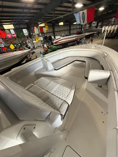 Fountain 34 Cc Yacht Photos Pics 2023 Fountain 34 CC boat interior with white seating in a showroom.