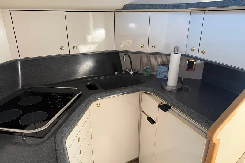  Yacht Photos Pics 1997 Sea Ray 370 Aft Cabin kitchen with modern appliances and sleek cabinetry.