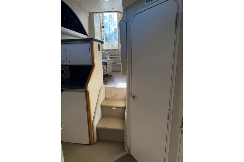  Yacht Photos Pics Interior view of 1997 Sea Ray 370 Aft Cabin yacht with stairs and cabinetry.