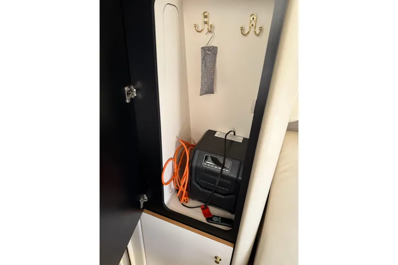  Yacht Photos Pics 1997 Sea Ray 370 Aft Cabin interior storage with hooks and electronic device.