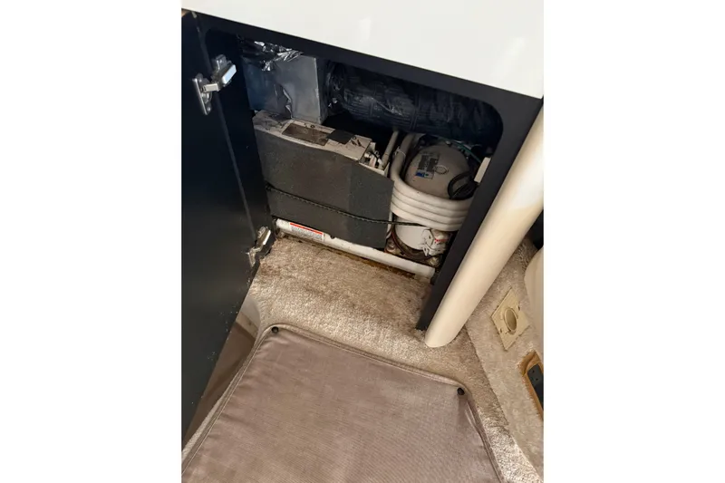  Yacht Photos Pics 1997 Sea Ray 370 Aft Cabin interior storage compartment with equipment and wiring.