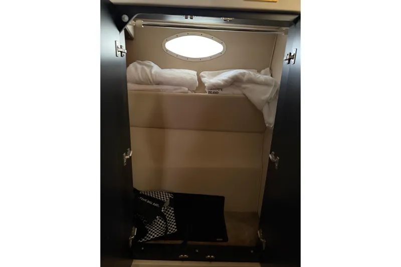  Yacht Photos Pics 1997 Sea Ray 370 Aft Cabin interior with cozy bedding and porthole window.