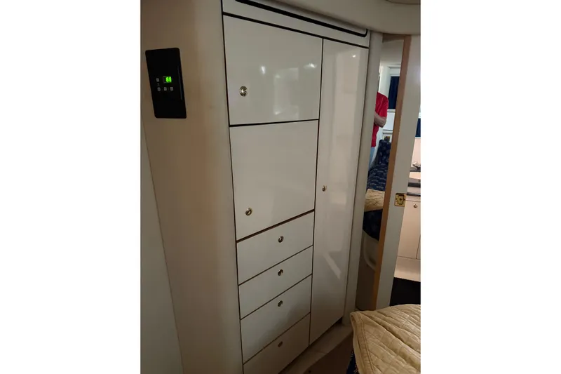  Yacht Photos Pics 1997 Sea Ray 370 Aft Cabin interior with white storage cabinets and digital control panel.