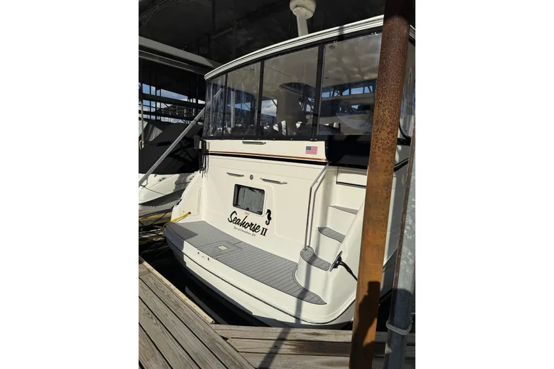  Yacht Photos Pics 1997 Sea Ray 370 Aft Cabin yacht docked, rear view with steps and enclosure.