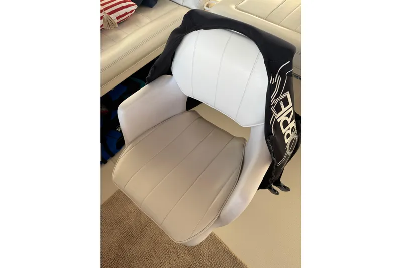  Yacht Photos Pics Captain's chair on 1997 Sea Ray 370 Aft Cabin yacht, with jacket draped over.