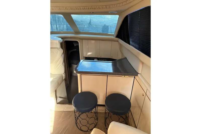  Yacht Photos Pics 1997 Sea Ray 370 Aft Cabin interior with seating and counter space.