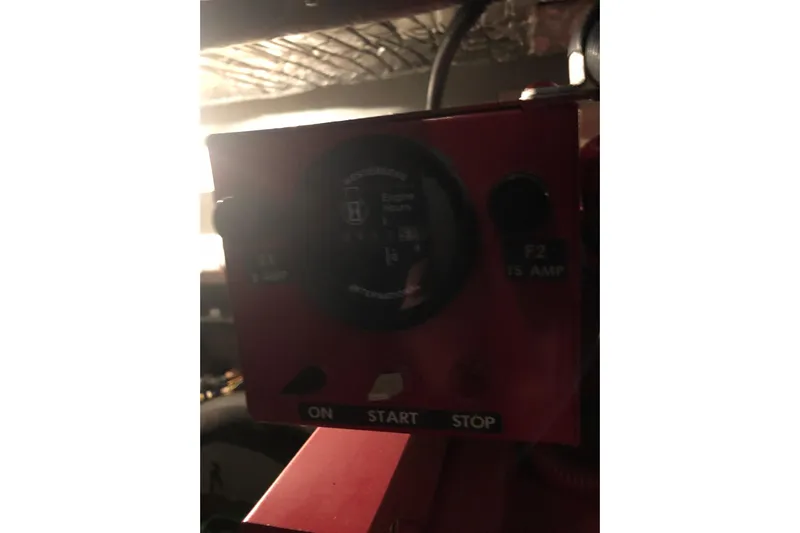  Yacht Photos Pics Control panel of a 1997 Sea Ray 370 Aft Cabin boat, featuring start and stop buttons.