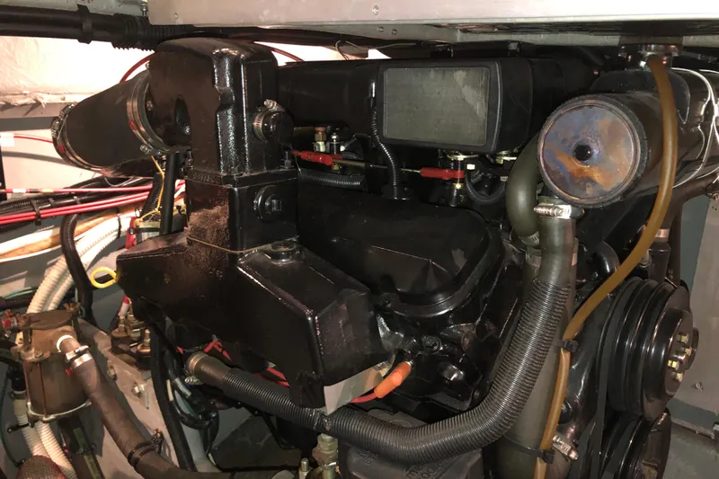  Yacht Photos Pics Engine compartment of a 1997 Sea Ray 370 Aft Cabin boat, showcasing mechanical components.