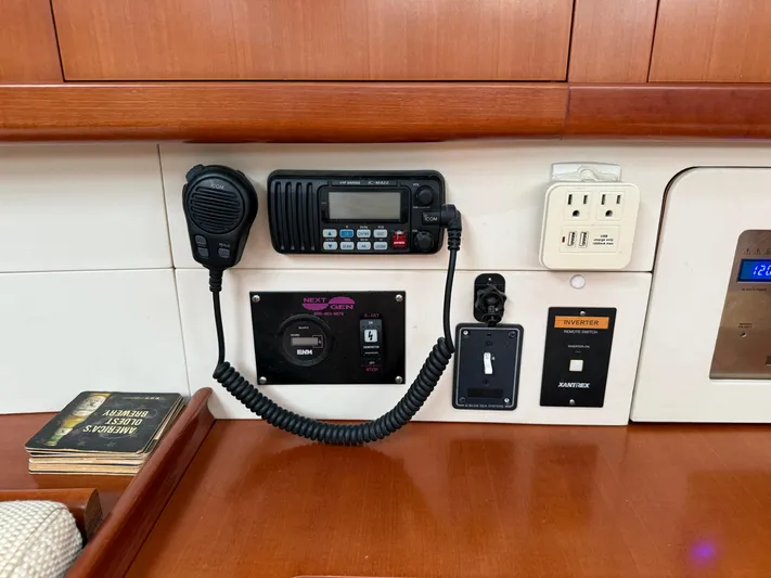 Passion Place Yacht Photos Pics Control panel of a 2007 Beneteau 49 yacht with radio and power outlets.