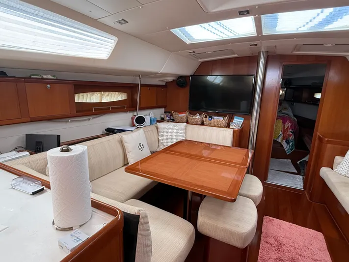 Passion Place Yacht Photos Pics Luxurious interior of 2007 Beneteau 49 yacht with dining area and modern amenities.